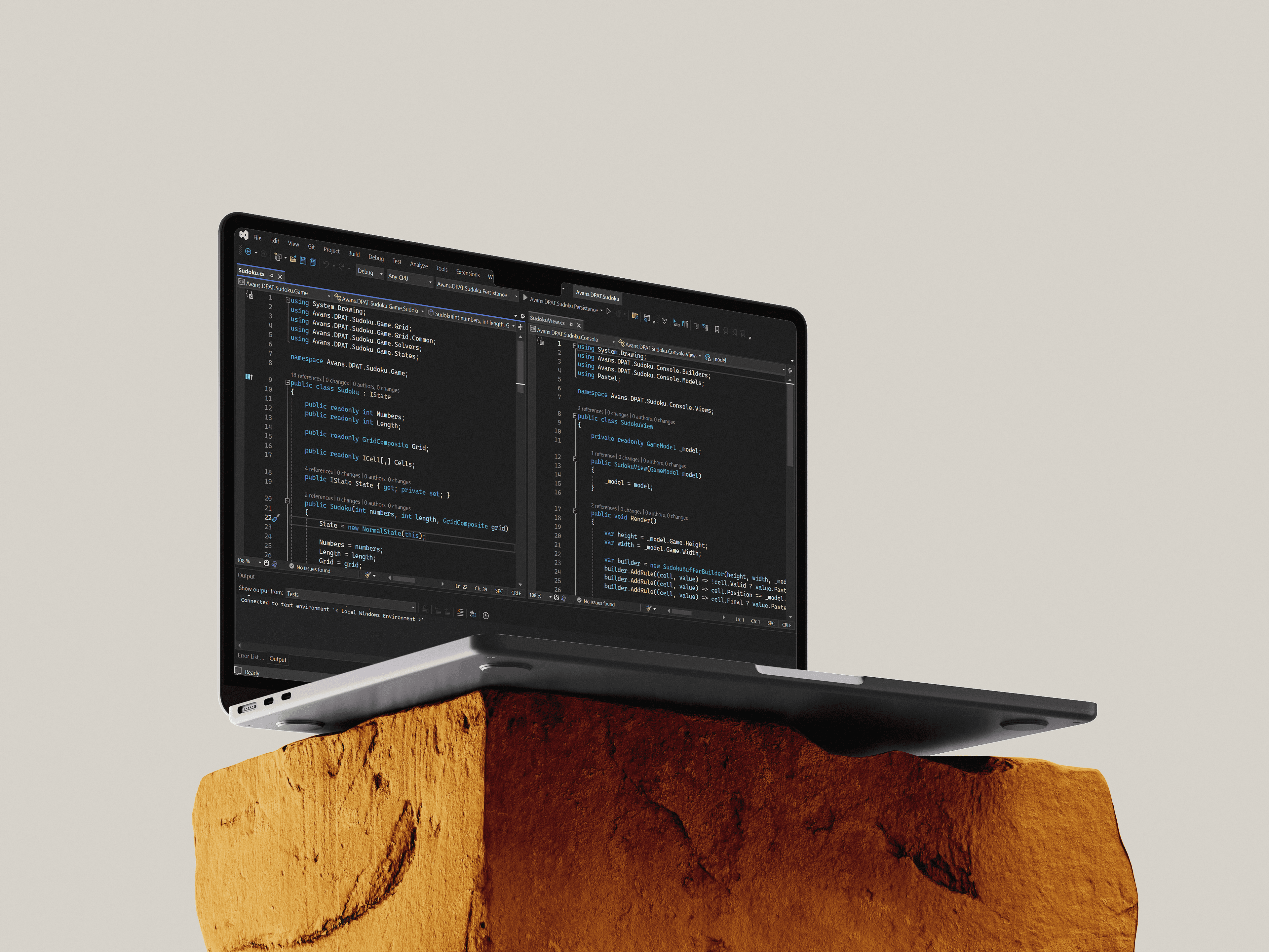 A laptop displaying code in an IDE